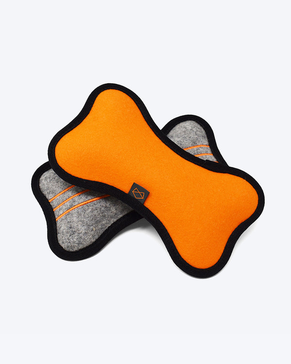 Plush tough dog toy made out of wool felt with 4 squeakers. Orange and Grey.