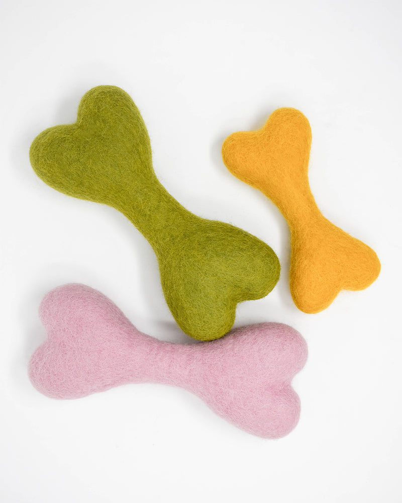 DOG BONE MADE OF 100% ORGANIC WOOL FELT DENSELY PACKED. ECO FRIENDLY. DURABLE. SMALL AND LARGE. GREEN, YELLOW, PINK.