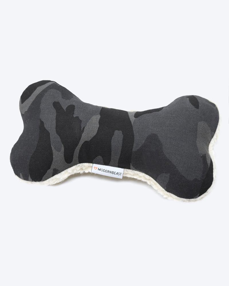 Camo plush canvas dog toy with a sherpa back and squeaker inside.