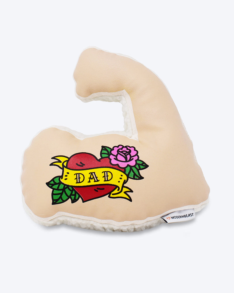 Cotton canvas dog toy in shape of flexing arm. Two squeakers. Dad is tattooed in a heart.