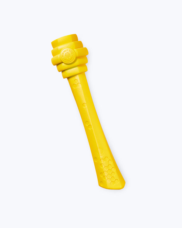 Yellow fetch stick with honeycomb pattern by Project Hive.