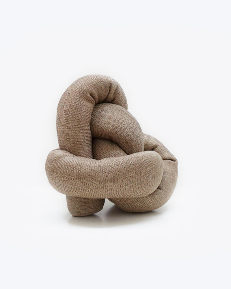 Tan cotton NOU by Lambwolf Collective. Long rope toy tied into a knot. 