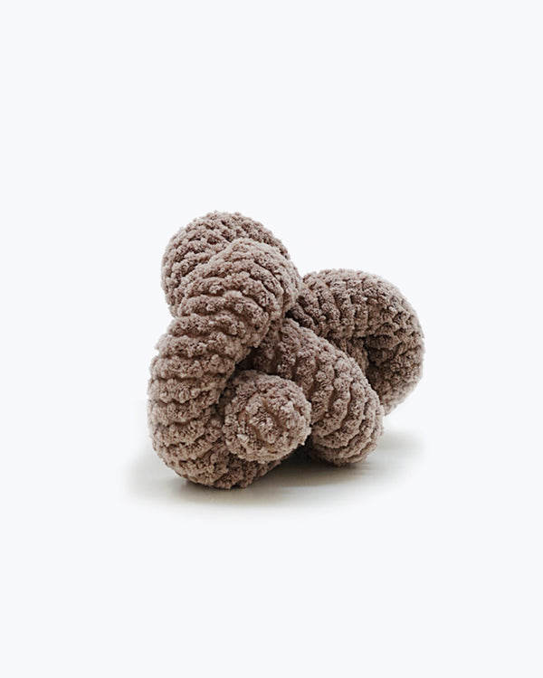 Tan corduroy NOU by Lambwolf Collective. Long rope toy tied into a knot. 