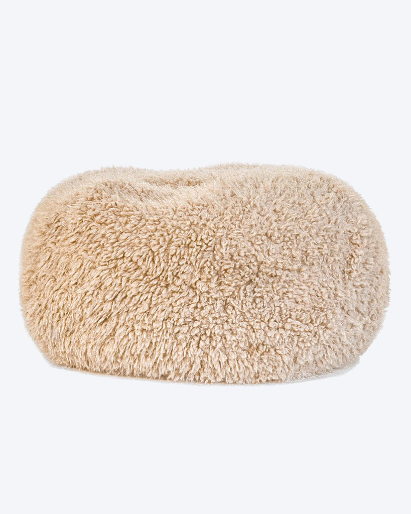 A dog bed is in tan soft material, available in small and large sizes and made out of recycled materials.