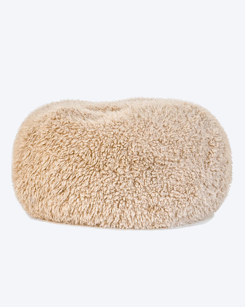 A dog bed is in tan soft material, available in small and large sizes and made out of recycled materials.