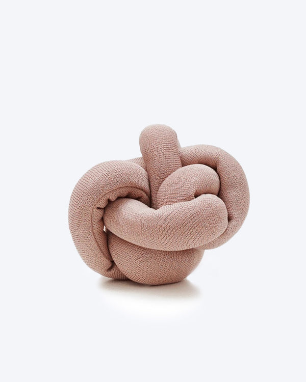 Pink NOUNOU by Lambwolf Collective. A long versatile toy tied into a knot.
