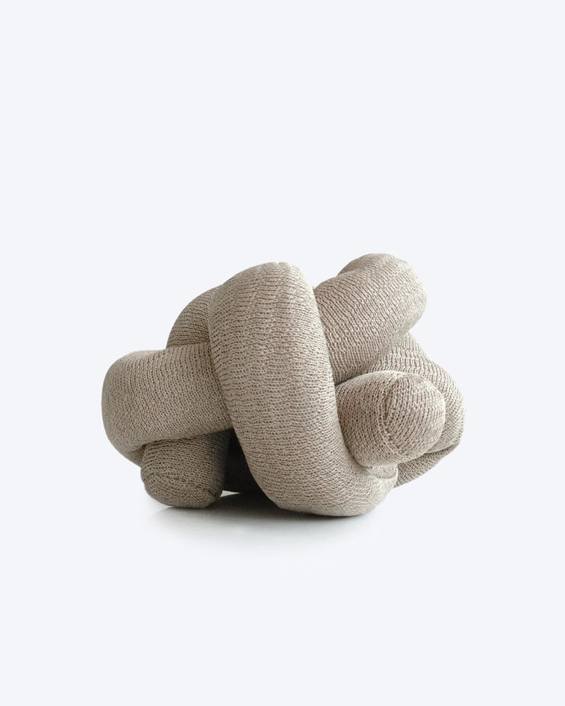 Tan NOUNOU by Lambwolf Collective. A long versatile toy tied into a knot.